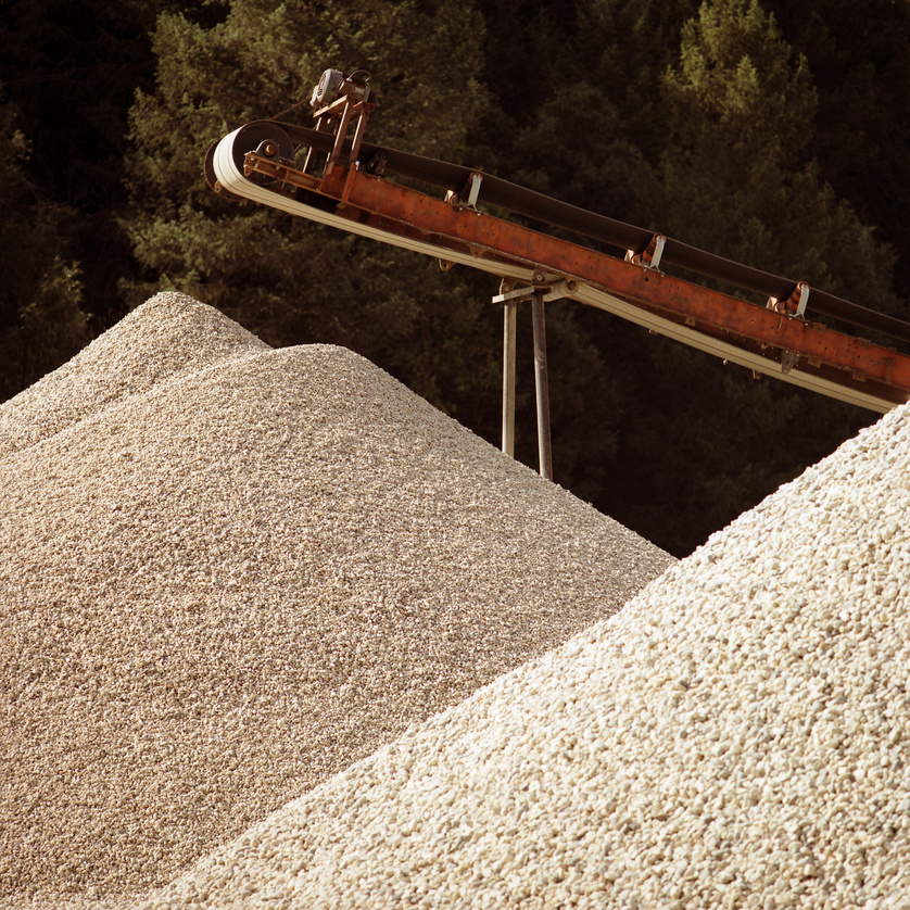 Piles Of Construction Material Under A Conveyor